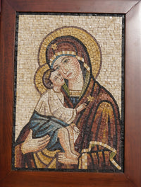 Intricate mosaic art depicting the Virgin Mary holding baby Jesus, framed in rich wood with warm tones and detailed textures.