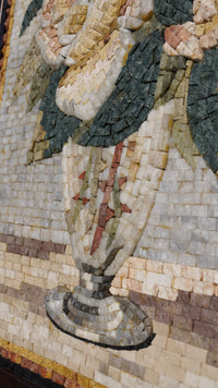 Intricate mosaic art piece featuring a detailed floral design — crafted from colorful natural stones arranged in a stunning pattern.