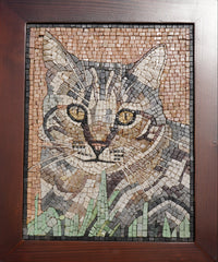 Intricate mosaic artwork featuring a cat's face in earthy tones — detailed craftsmanship with glass and stone tiles.