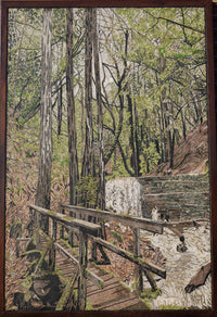 Intricate tapestry artwork depicting a serene forest scene with vibrant greenery and a wooden bridge over flowing water