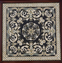 Intricate black tapestry featuring floral patterns and gold accents — a stunning piece of textile art with rich textures.