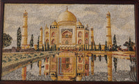 Intricate mosaic artwork depicting the Taj Mahal in warm hues — detailed craftsmanship reflecting historic architecture.