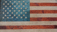 Colorful mosaic American flag featuring vibrant blue and red tiles with white stars and stripes creating a textured finish