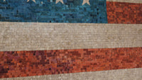 Mosaic American flag design featuring vibrant blue, red, and white tiles with a textured finish that captures light beautifully
