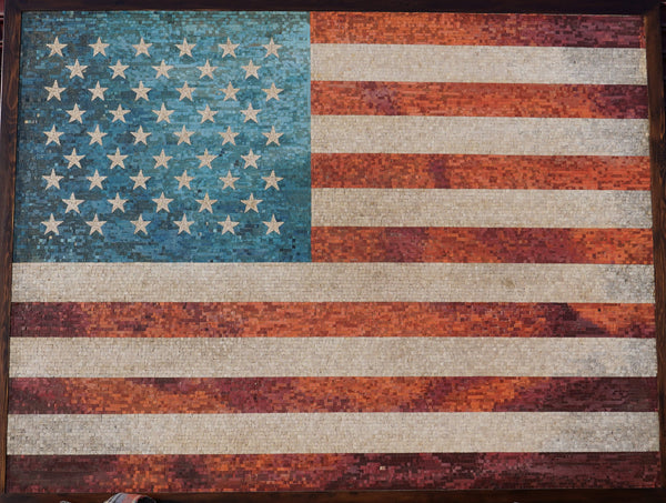 Intricate mosaic American flag artwork featuring vibrant red, white, and blue tiles with a textured finish