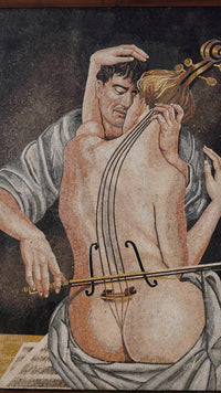 Intricate mosaic artwork depicting a couple embracing — the man plays a cello while the woman rests against him.