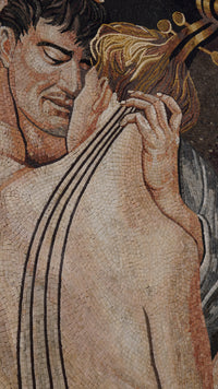Intricate mosaic artwork depicting an intimate embrace — featuring warm tones and detailed textures in natural stone.