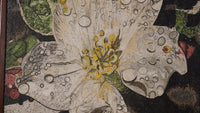 Intricate floral mosaic artwork featuring a large white flower with textured petals and vibrant green leaves.