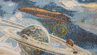Colorful mosaic artwork depicting planets in a starry sky — intricate details with vibrant blues and textured tiles.
