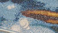 Intricate mosaic artwork featuring vibrant blue tiles with golden and brown accents — a stunning display of craftsmanship.