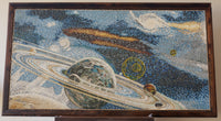 Vivid mosaic art depicting planets and rings in a cosmic scene — intricate details on a textured canvas backdrop