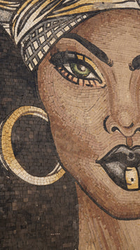 Vibrant mosaic wall art featuring a woman's face with striking green eyes and bold black lips — intricate tile work in earthy tones.