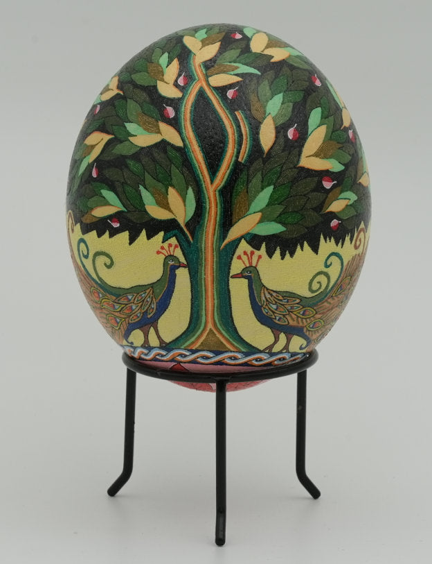 Intricately painted decorative egg featuring vibrant peacocks and a tree design — a unique piece of folk art craftsmanship.