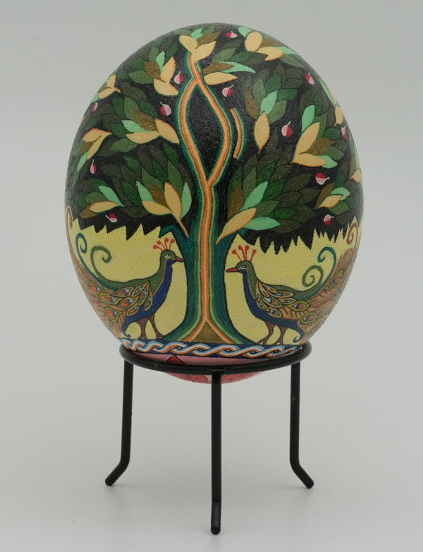 Intricately painted decorative egg featuring vibrant peacocks and a tree design — a unique piece of folk art craftsmanship.