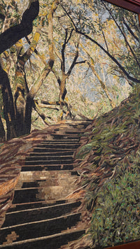 Intricate mosaic artwork depicting a sunlit forest path with textured tiles creating a vibrant, natural scene