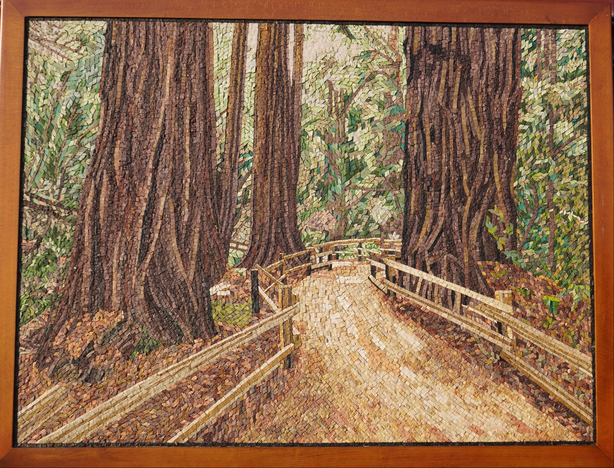 Intricate wooden puzzle depicting a serene forest path lined with towering trees and a rustic wooden fence.