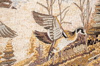 Intricate mosaic artwork featuring birds and trees in warm earthy tones, showcasing detailed craftsmanship and texture.