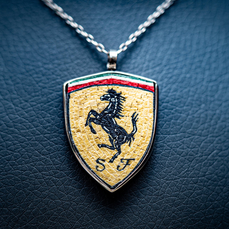 Stylish Ferrari pendant necklace featuring a silver chain and a vibrant shield design with a prancing horse emblem