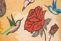 Vibrant mosaic art featuring a red rose surrounded by colorful hummingbirds against a warm yellow background