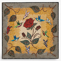 Intricate mosaic wall art featuring a vibrant red rose surrounded by colorful hummingbirds and leafy vines on a golden background