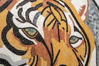 Intricate mosaic wall art featuring a fierce tiger's face in warm earthy tones — showcasing detailed craftsmanship and texture.