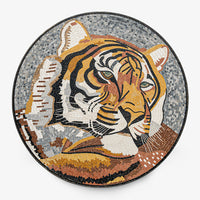 Intricate mosaic tiger artwork featuring warm earth tones and detailed textures — a stunning round wall decoration.