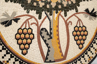 Intricate mosaic art featuring a grapevine design with black and gold accents — showcasing detailed craftsmanship and vibrant colors