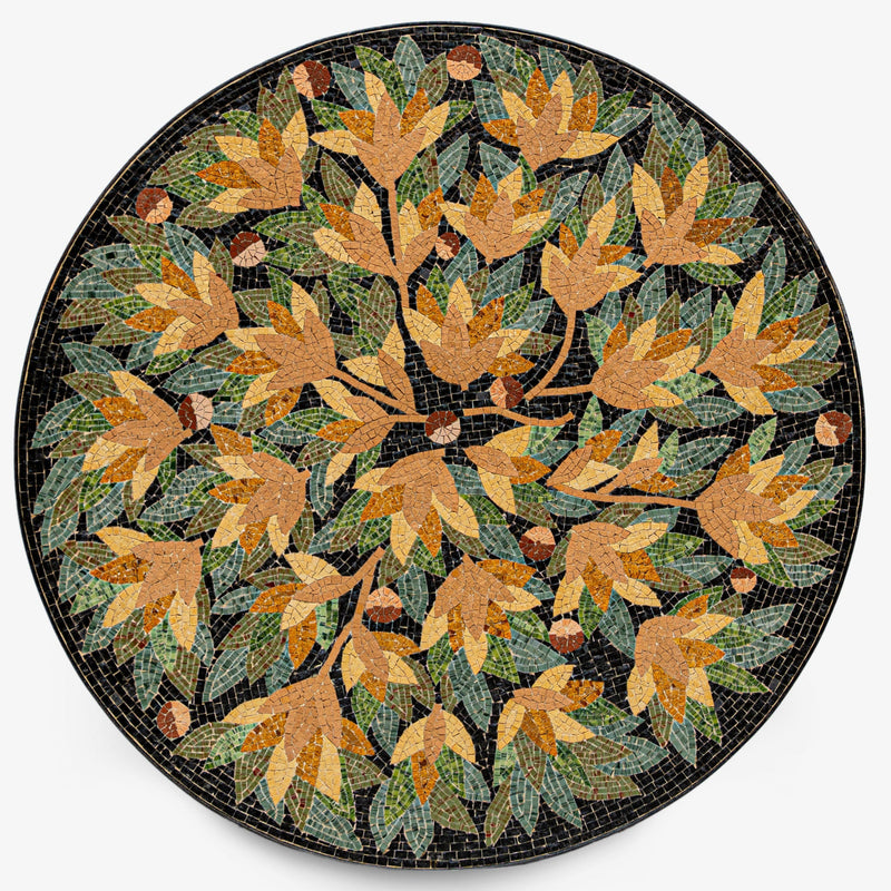 Intricate mosaic table featuring autumn leaves in earthy tones — a stunning centerpiece with a textured black background.