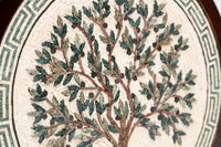 Intricate mosaic wall art featuring a tree design with green leaves and brown branches — crafted from natural stone tiles.