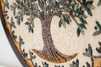 Intricate mosaic wall art featuring a detailed tree design with earthy tones and textured stone elements that enhance its natural beauty