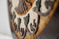 Intricate wood wall art featuring a natural finish with detailed carvings and a rustic charm that enhances any decor.