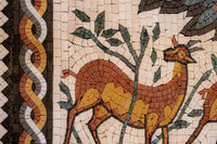 Intricate mosaic featuring a stylized gazelle in warm earthy tones — detailed craftsmanship with natural stone tiles.