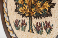 Intricate mosaic wall art featuring a vibrant tree design with yellow leaves and purple irises set against a textured background