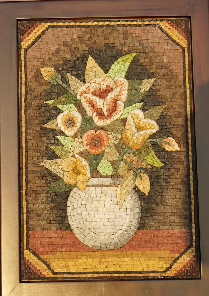 Intricate mosaic artwork featuring a vase of colorful flowers — crafted from natural stone tiles with a textured finish.