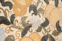 Intricate floral mosaic design featuring soft blue and golden tiles with swirling green leaves enhancing the textured surface.
