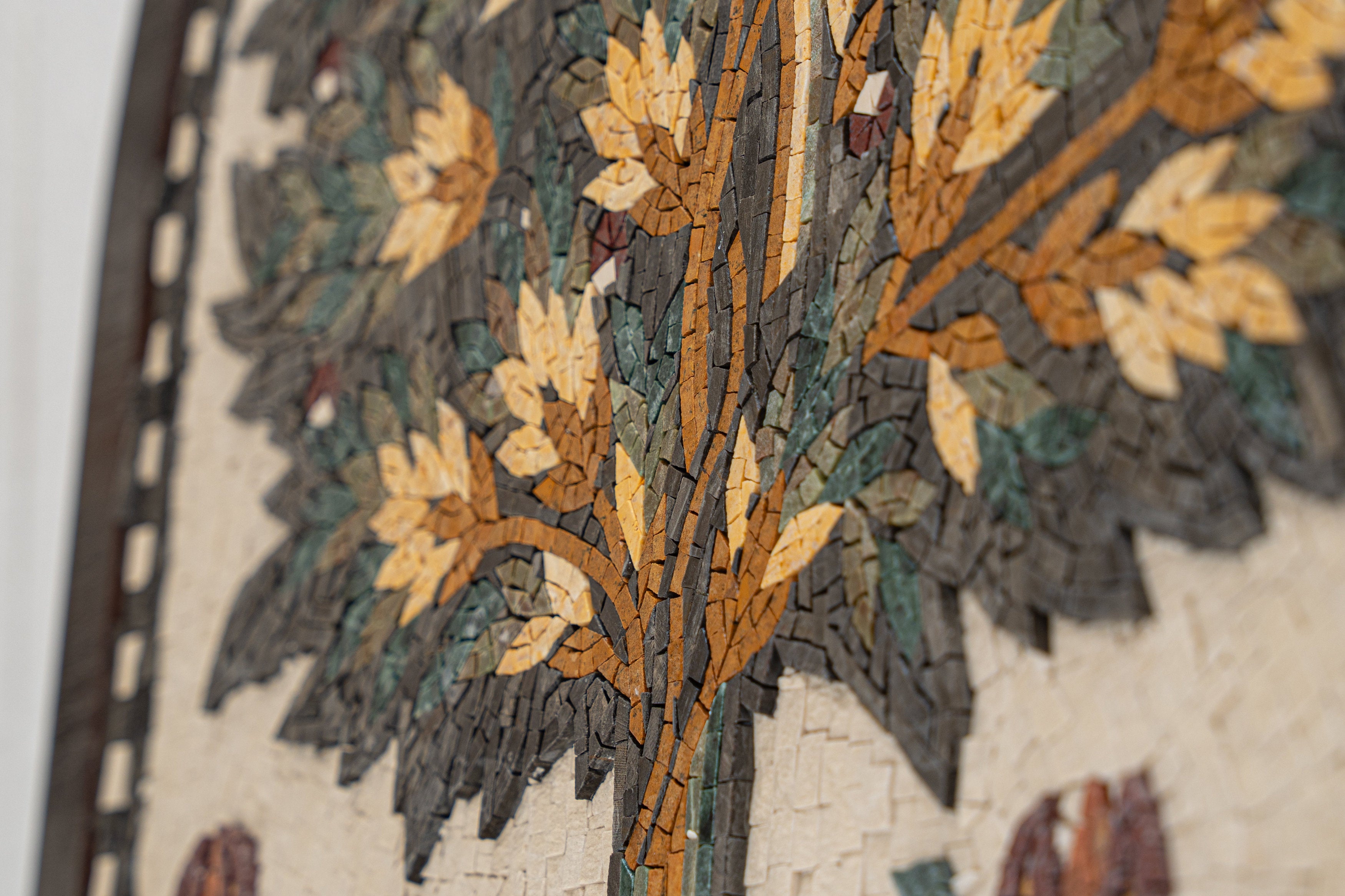 Intricate mosaic wall art featuring a vibrant tree design in earthy tones of brown, green, and ochre — a stunning handcrafted piece.