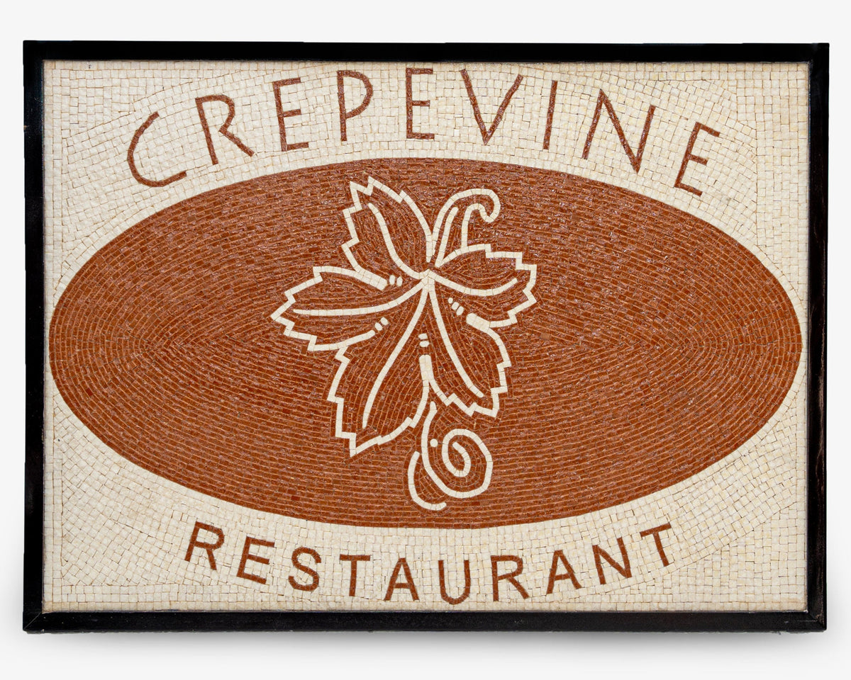 Artisan mosaic sign for Crepevine Restaurant featuring a textured brown background with a detailed leaf design