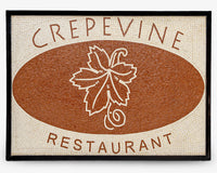 Artisan mosaic sign for Crepevine Restaurant featuring a textured brown background with a detailed leaf design