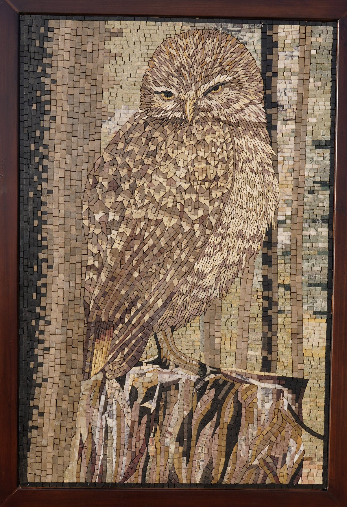Intricate mosaic artwork depicting a brown owl perched on a tree stump — crafted from various natural wood tones.