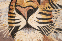 Intricate mosaic art featuring a lion's face crafted from natural stone tiles in earthy tones — showcasing detailed craftsmanship.