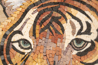 Intricate mosaic artwork depicting a tiger's face with earthy tones and detailed textures highlighting its piercing eyes