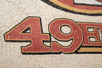 Red and black mosaic tile art featuring the number 49 — a detailed representation of classic sports memorabilia.
