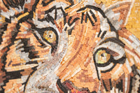 Intricate mosaic artwork featuring a lion's face with vibrant colors and detailed textures capturing its fierce gaze