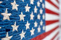 Vibrant American flag mosaic featuring textured red and white stripes with raised blue stars for a striking visual impact