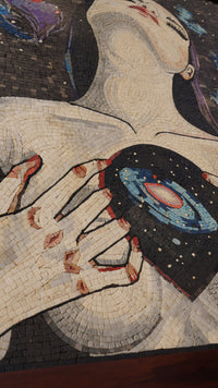 Intricate mosaic artwork featuring a woman holding a galaxy — vibrant colors and detailed textures create a stunning visual impact.