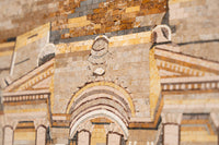 Intricate mosaic artwork featuring earthy tones and textured stone pieces — showcasing detailed craftsmanship and design.