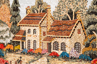 Intricate mosaic art featuring a charming cottage with textured tiles in warm earth tones and vibrant floral accents
