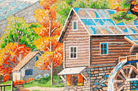 Vibrant mosaic artwork depicting a rustic wooden cabin surrounded by autumn trees — showcasing intricate tile patterns and colors.