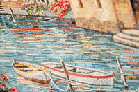 Intricate mosaic artwork featuring two white boats with red accents on a shimmering blue water surface — vibrant colors create a serene scene.