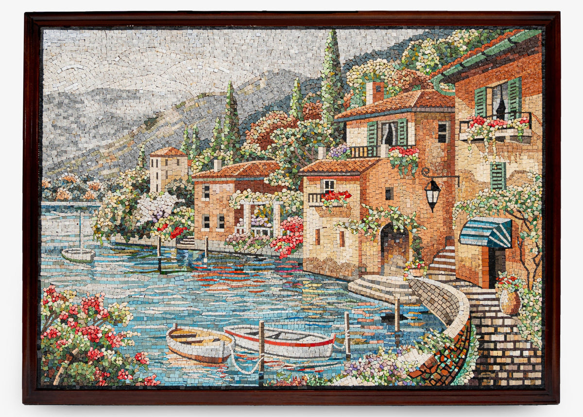 Vibrant mosaic artwork depicting a serene lakeside village with colorful houses and blooming flowers — intricate tile detail enhances the scene.